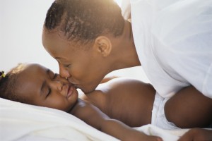 Mother Kissing Toddler's Cheek