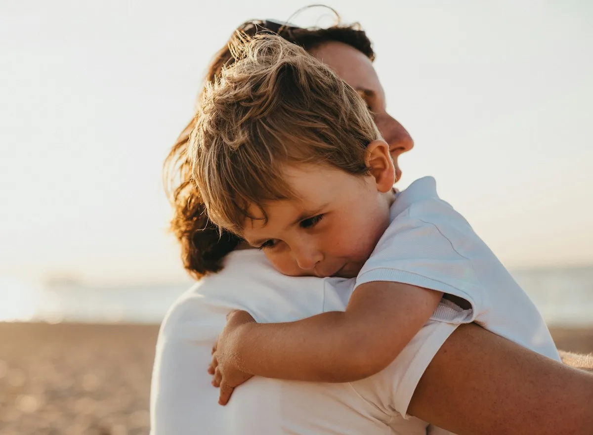 Toddler hugging a parent for comfort, ear infection support in Meridian
